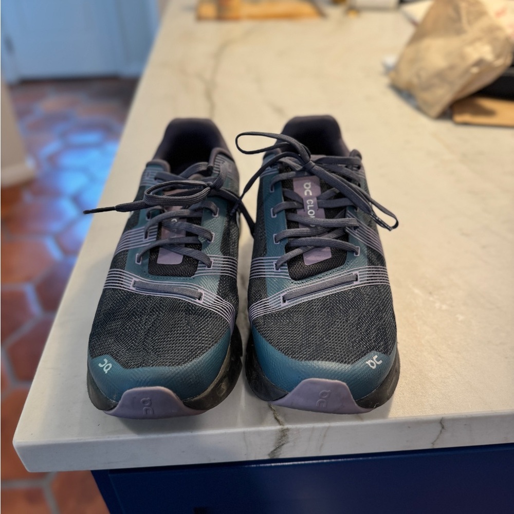 On Running Black and Blue Athletic Shoes with Modern Comfort